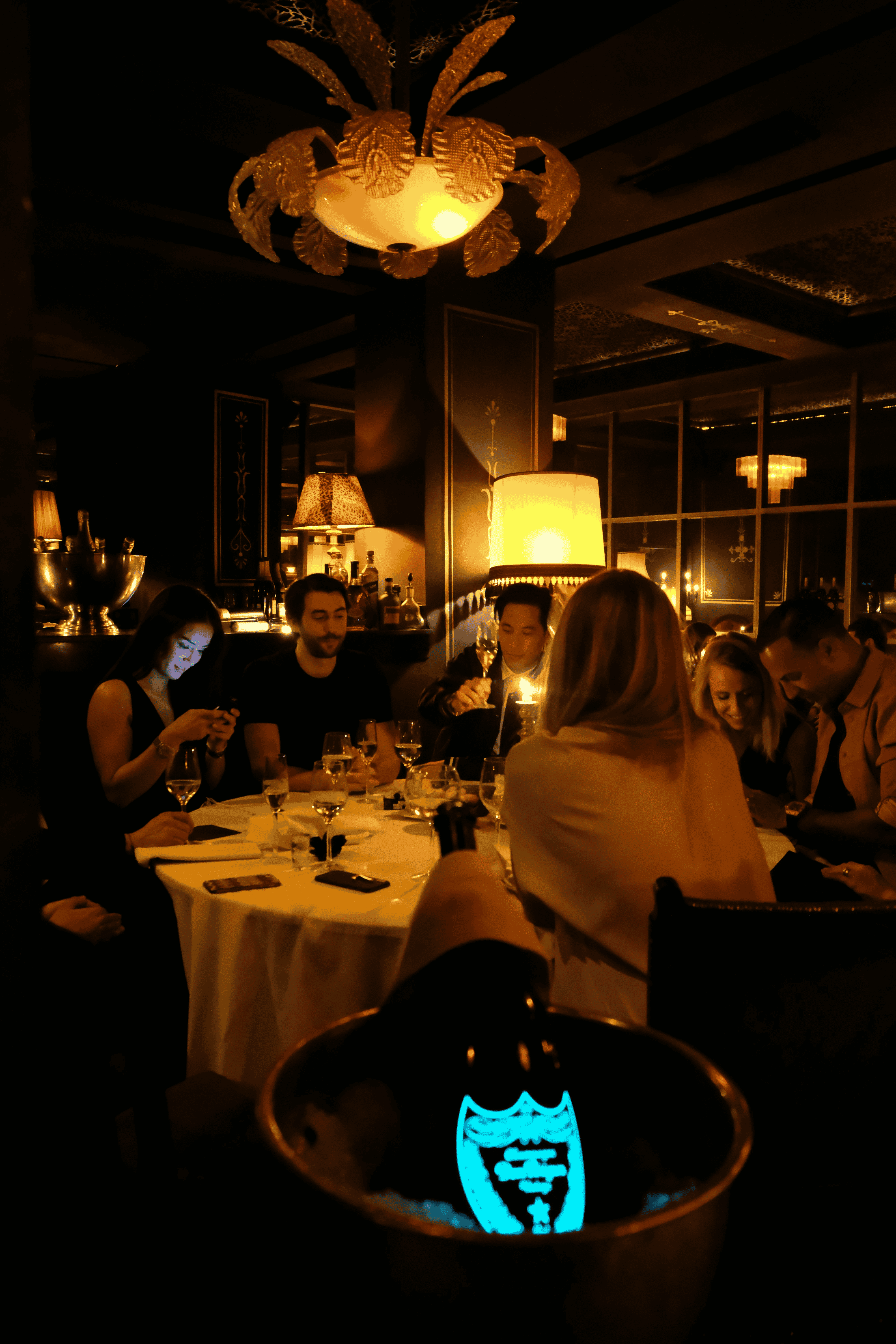 Friends enjoying dinner in a cozy restaurant
