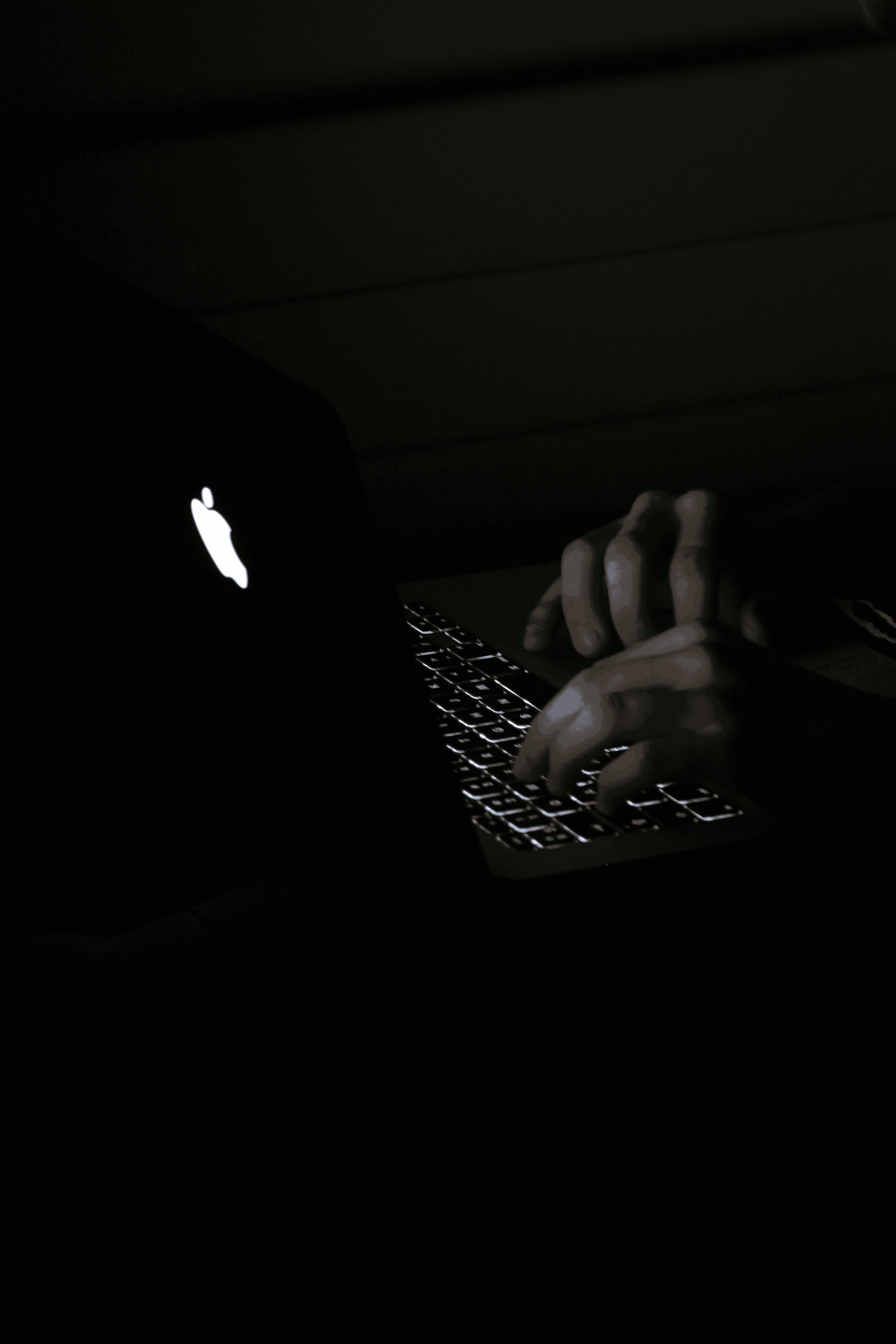 Photographer editing photos late at night